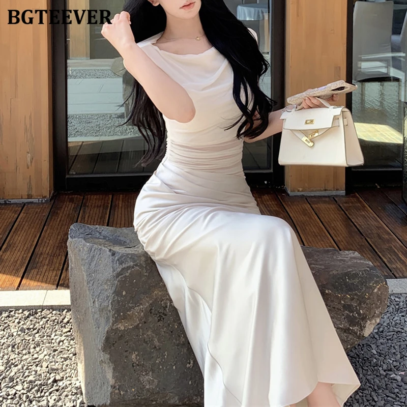 BGTEEVER فستان صيفي أنيق للسيدات نحيف مرقع من الساتان أنيق برقبة دائرية للنساء بدون أكمام فستان الورك