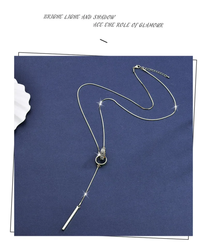 

Full diamond double-ring tassel long necklace, elegant and versatile double-ring sweater chain pendant