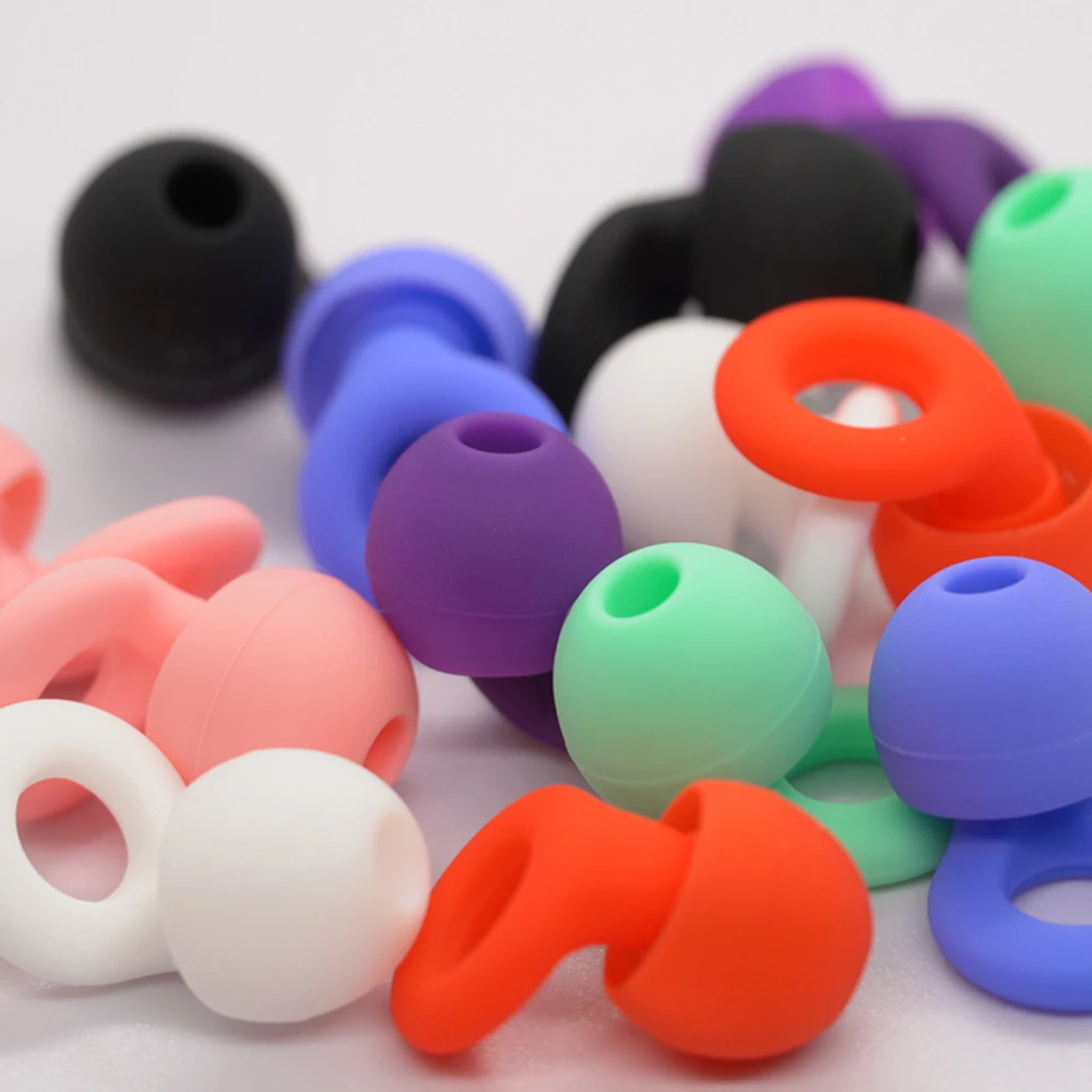 سدادات أذن من السيليكون لتقليل الضوضاء من HUAK - فائقة النعومة وقابلة لإعادة الاستخدام لحماية السمع للنوم والسباحة والعمل 8 أطراف أذن XS/S/M/L