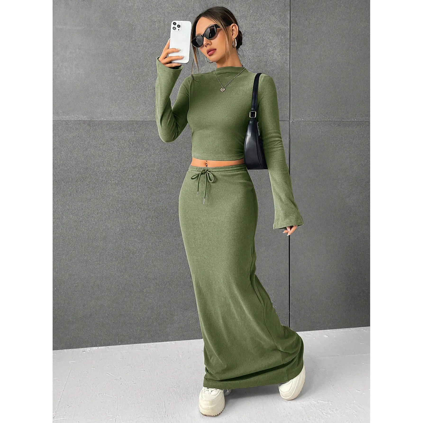 

Осень-зима Новый однотонный круглый вырез с длинным рукавом Короткий топ с эластичной резинкой на талии Длинная юбка Комплект модных сексуальных тонких комплектов из двух предметов на шнуровке