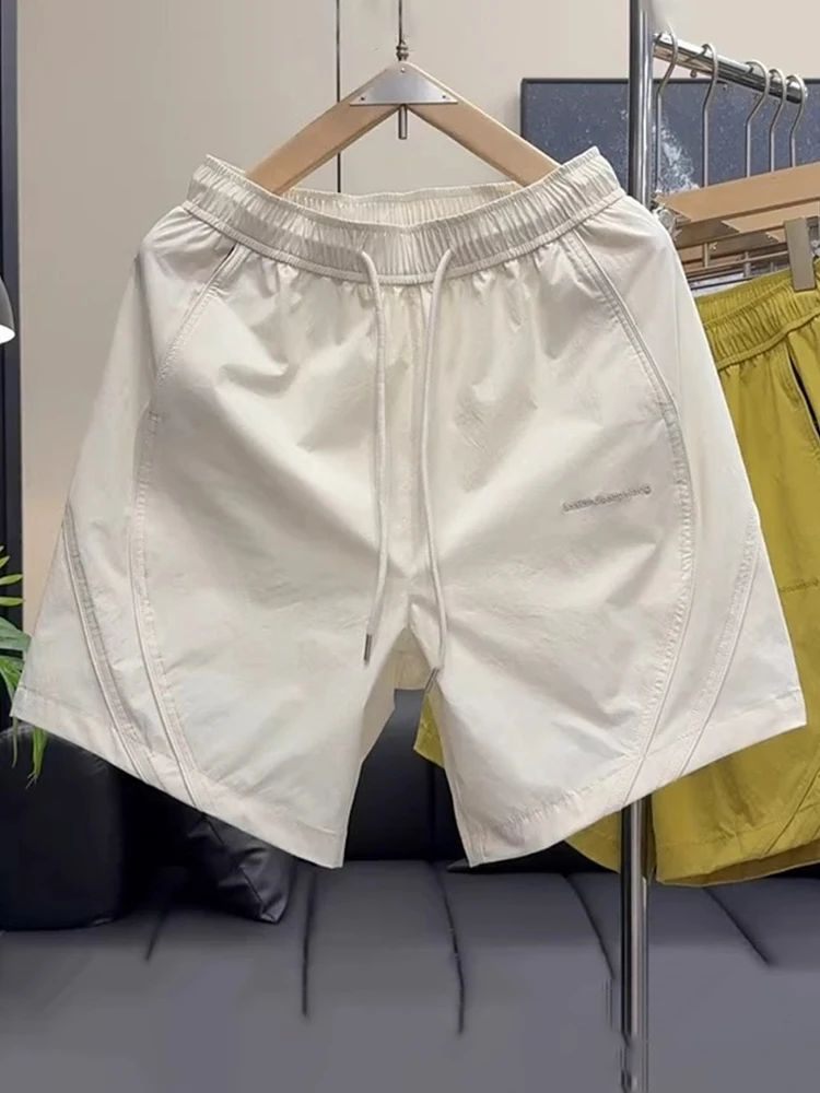 

Модные тонкие спортивные мужские брюки Qui Dry, лето 202, свободные повседневные дышащие брюки из ледяного шелка «пять четвертей», повседневные прямые брюки...