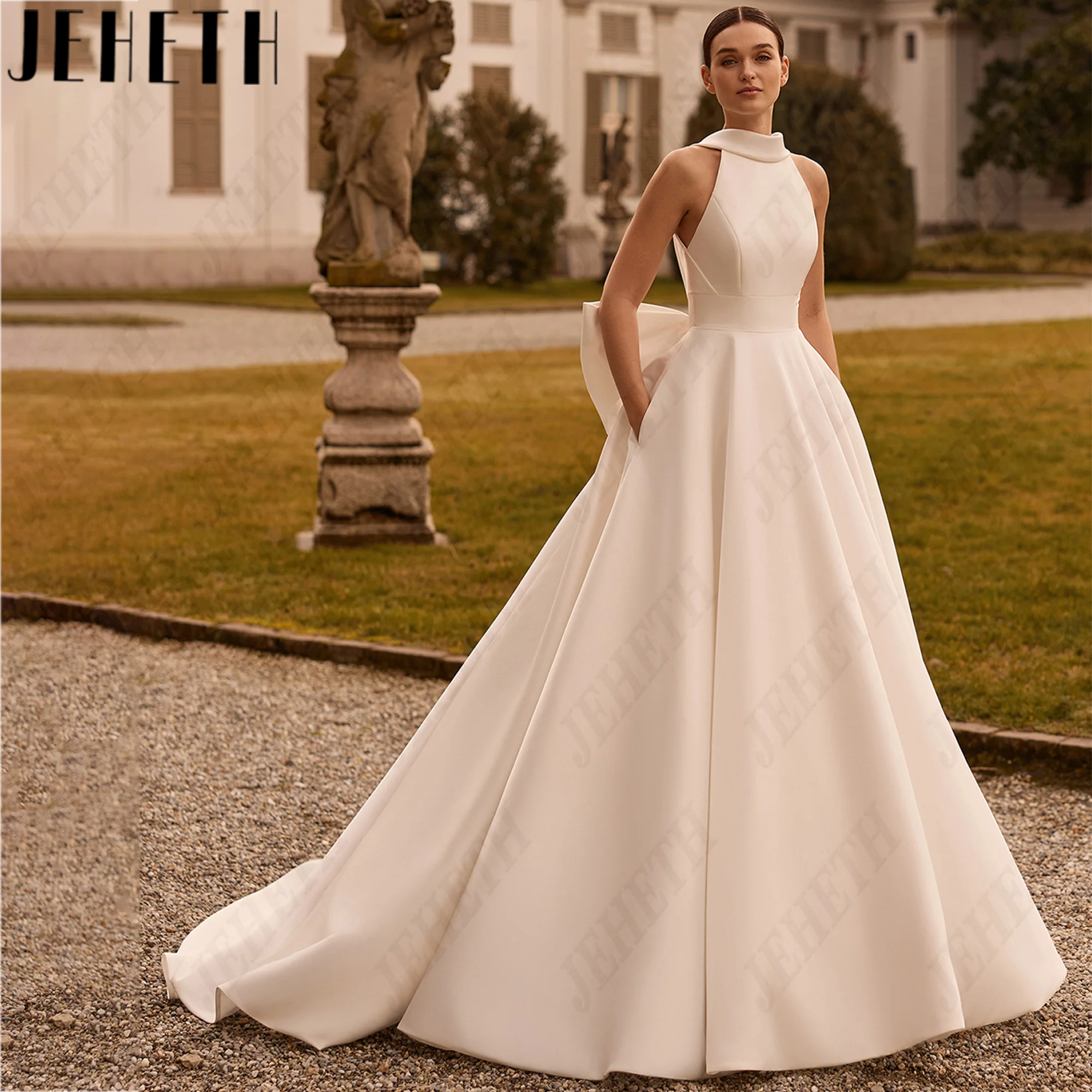 JEHETH High Neck Satin A Line Wedding Dress Big Bow Backless Sleeveless Bridal Gown Sweep Train Pocket Bride Dresses Custom Made