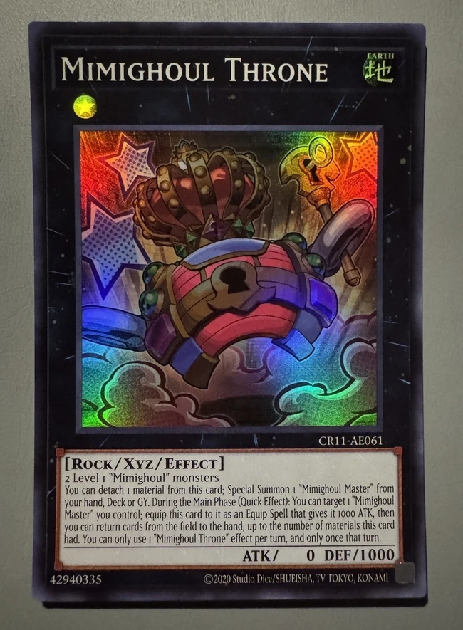 

Yugioh KONAMI Duel Monsters CR11-AE061 Mimighoul Throne Super Rare Asian English Collection Mint Card
