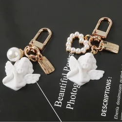 Vintage White Angel Cupid Keychain Fashion Imitation Pearl Heart Key Ring for Women Girls Earphone Phone Case Pendant Xmas Gifts
