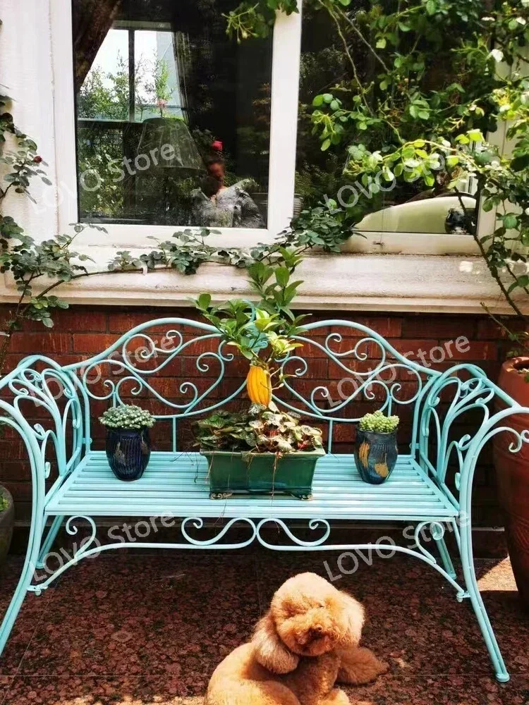 Outdoor garden bench  wrought iron table and chairs  balcony Courtyard