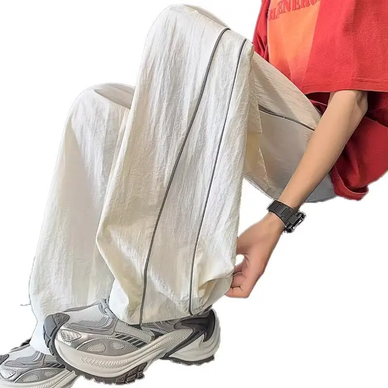 Été mince ample droit pantalons décontractés hommes jeunesse étudiant américain décontracté conception réfléchissante à la mode Sport pantalons longs