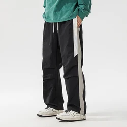 Pantalones de pierna ancha para hombre, pantalón informal, holgado, con bolsillos a rayas, con cordón, para viaje diario, primavera y verano, nueva moda