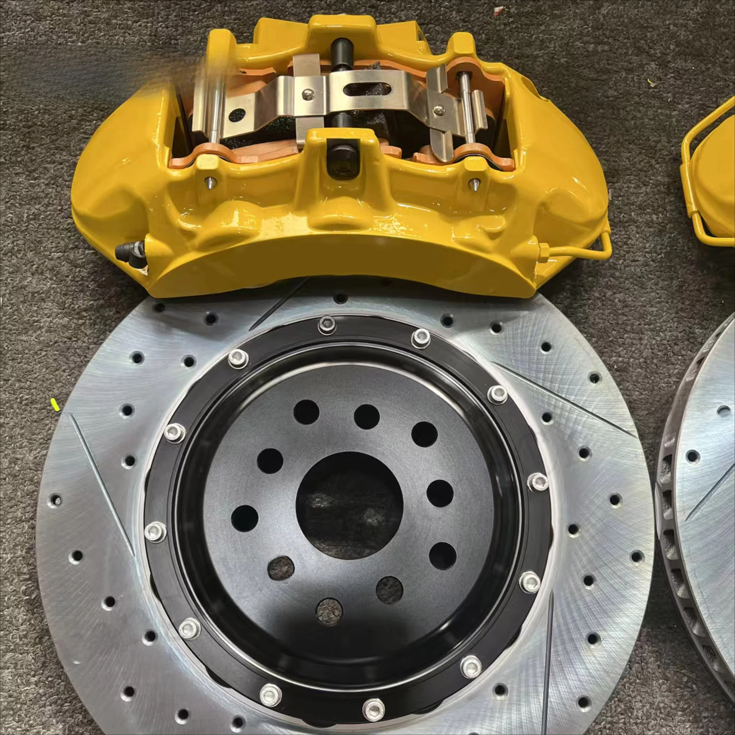 

Custom yellow 6-piston brake caliper with custom 355mm brake disc