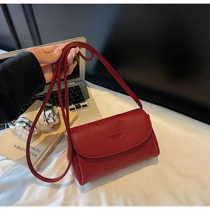 おしゃれでシックなレザー製おむつバッグ、高級デザイナーの女性用クロスボディバッグ、エレガントでミニマルなハンドバッグ