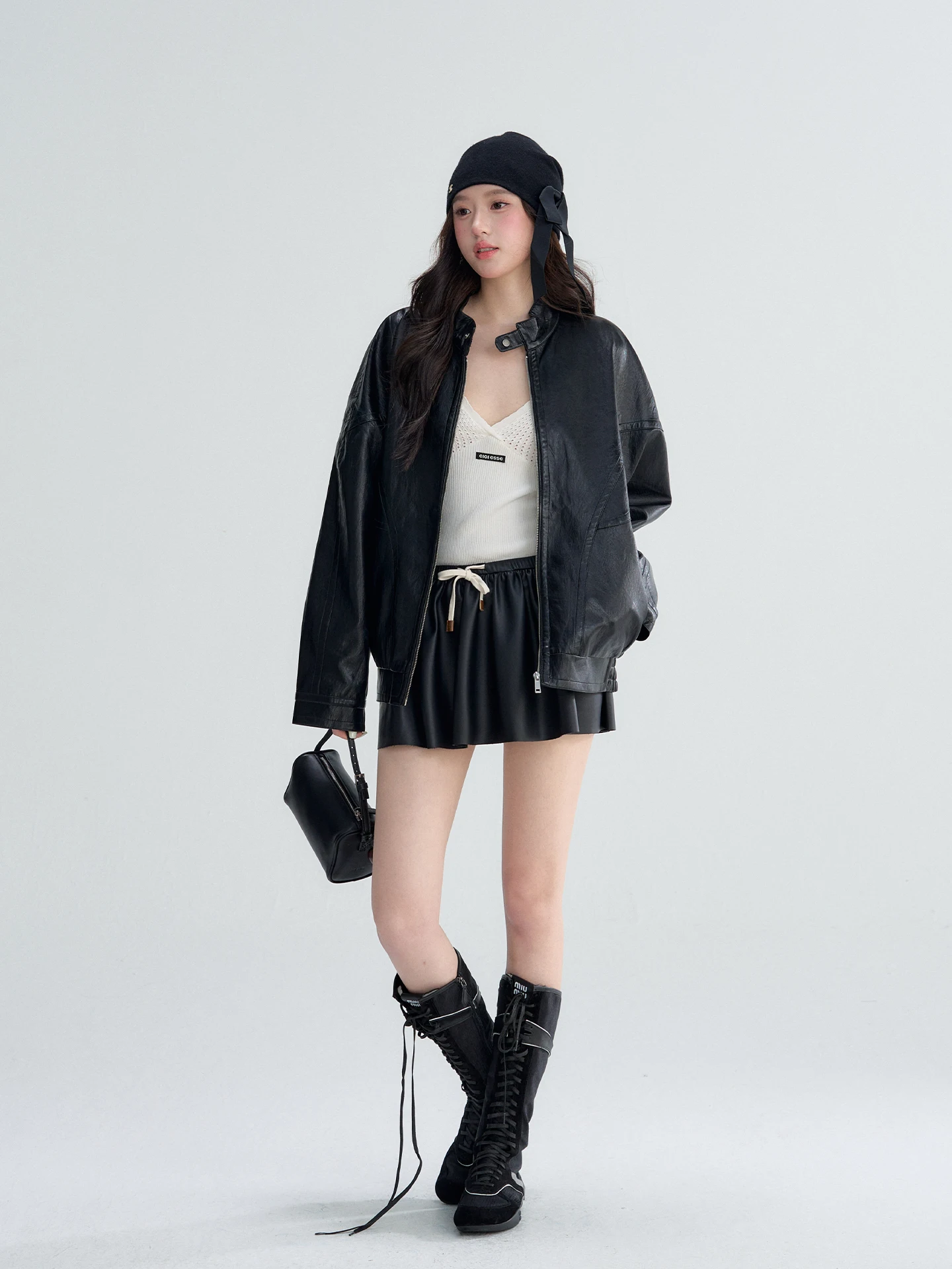 OIOI E Conjunto de Saia e Jaqueta de Couro PU com Gola Alta para Início da Primavera, Design Sensacional Feminino, Comprimento Regular, Moda Jovem