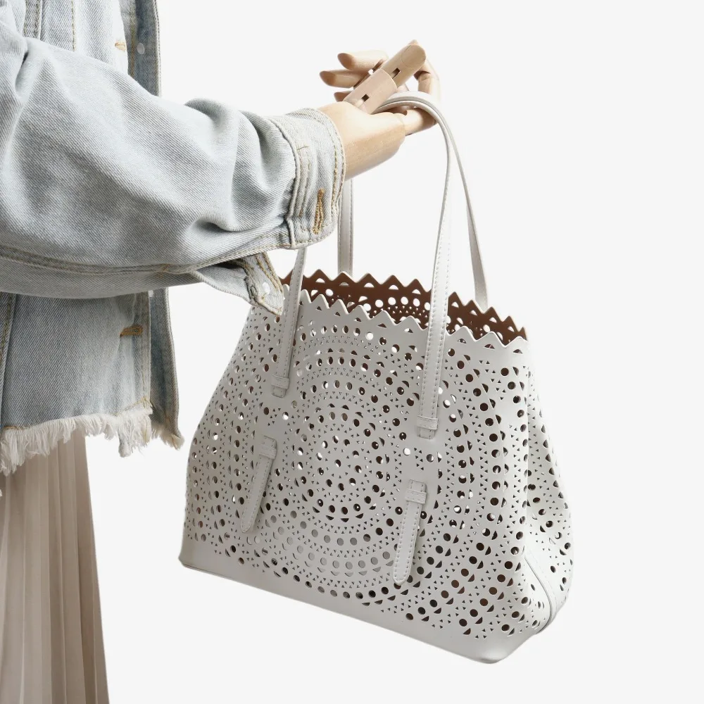 

2026 New Cowhide Circle Hollow Engraved Vegetable Basket Genuine Leather Shoulder Crossbody Bag Tote Bag Women