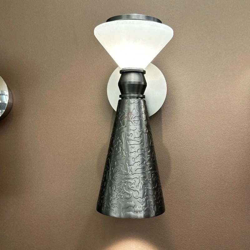 Modern decorative wall lamp with marble lampshade and innovative shaped metal frame, suitable for homes, hotels, and villas