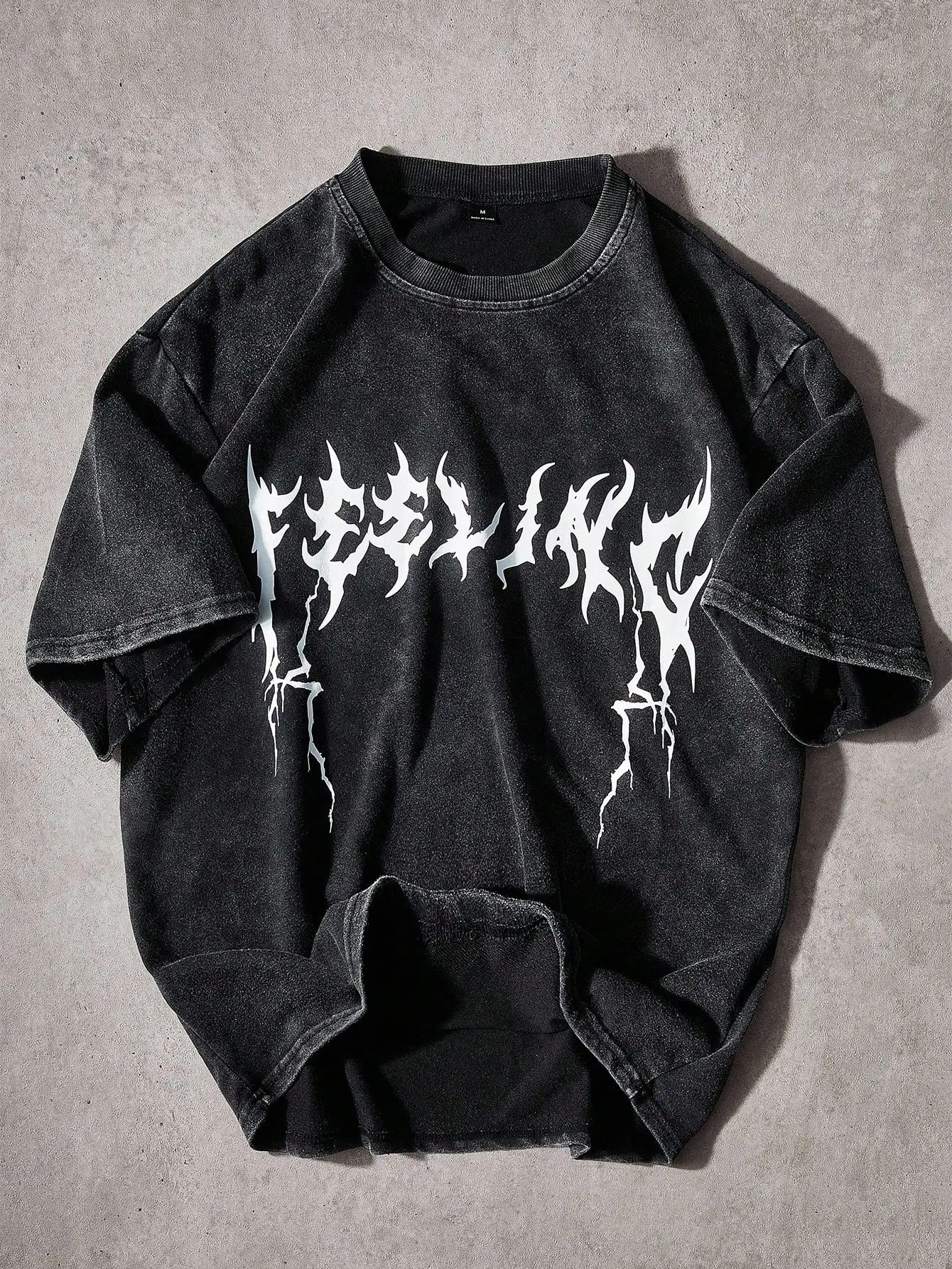 

Men's Oversized Distressed Black Graphic Tee with Acid Wash Effect and Bold Flame-Style Print