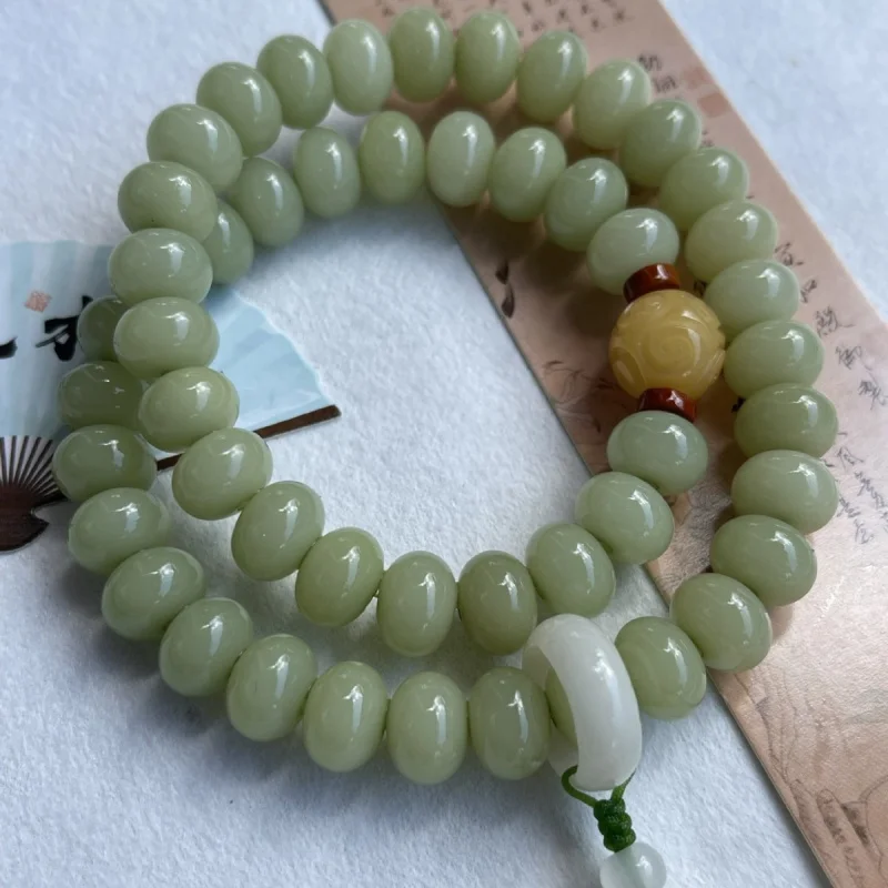 

A green jade root in traditional Chinese style, double-loop bodhi seed hand-held Buddhist bead bracelet for women