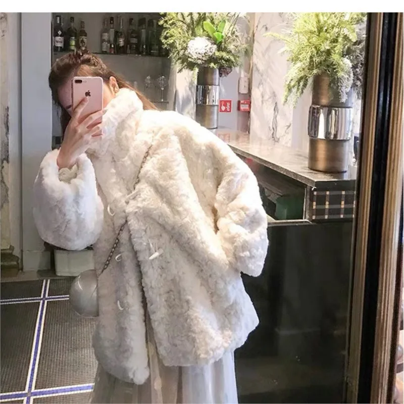 

A new mid-length women's lambing and fur coat with laid-back style horn buttons