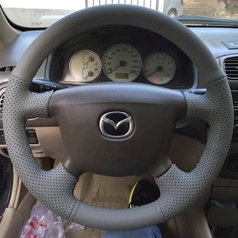 

Hand-stitched grey Genuine Leather non-slip car steering wheel cover 100% Fit for Mazda 323 Premacy FAMILY