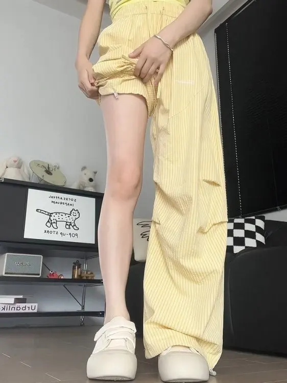 กางเกงลำลองลายทางสีเหลืองปักลายสำหรับผู้หญิง ฤดูหนาว ทรงหลวม ขากว้าง เหมาะสำหรับเต้นแจ๊ส เอวสูง ยางยืด