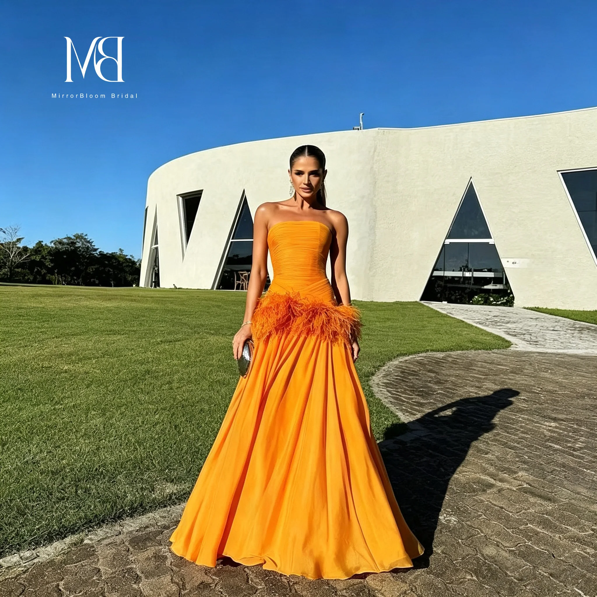 Vibrant Strapless A Line Evening Gown Ruched Bodice Hand Attached Feather Embellishments Flowy Chiffon Floor Length Formal Dress