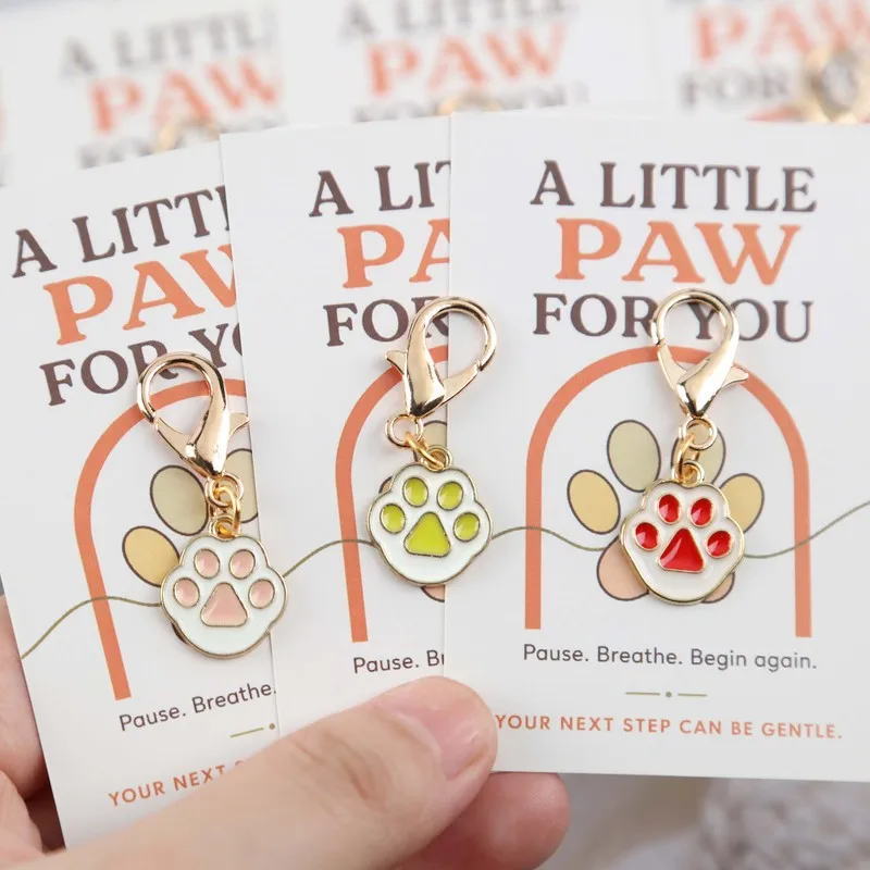 8Macaron multi-colored cat paw keychain set Self-encouragement and holiday-themed small ornaments Includes an inspirational gree