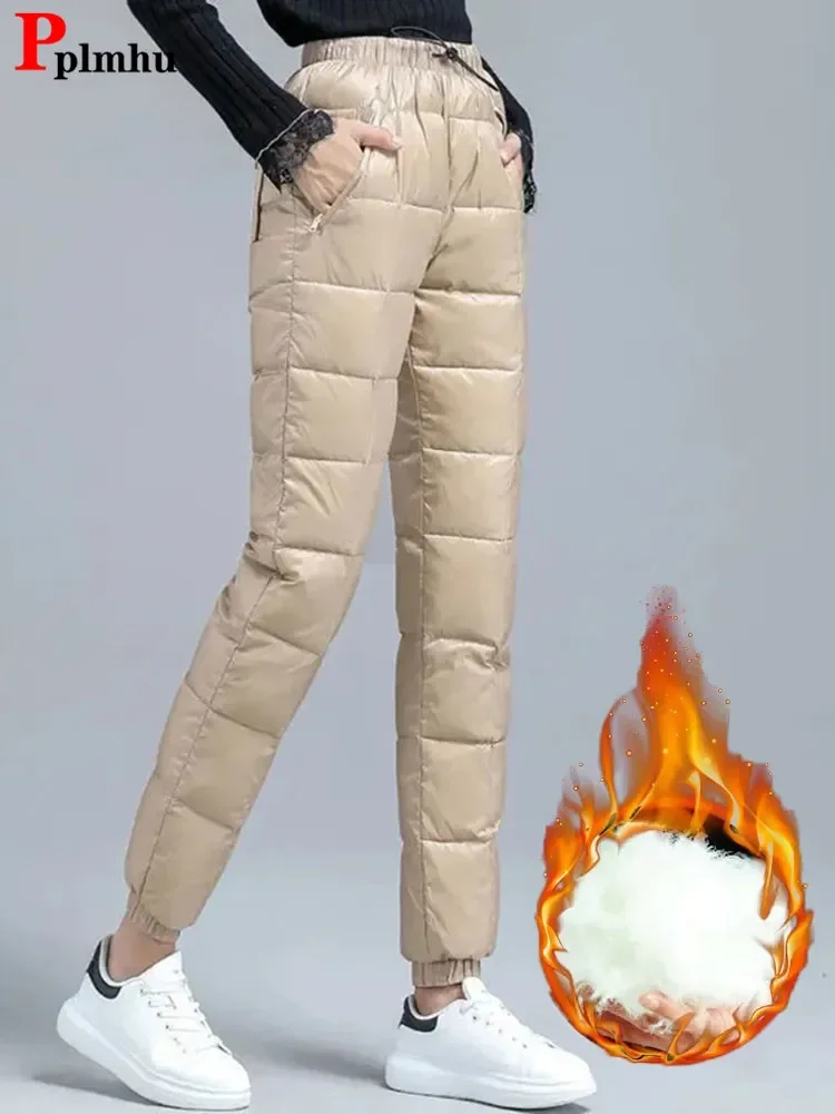 Ultraleichte Winter Daunen Baumwoll hose Frauen übergroße 95kg Schnee tragen lässige Jogger Pantalones wind dichte warme Baggy Harem Jogging hose