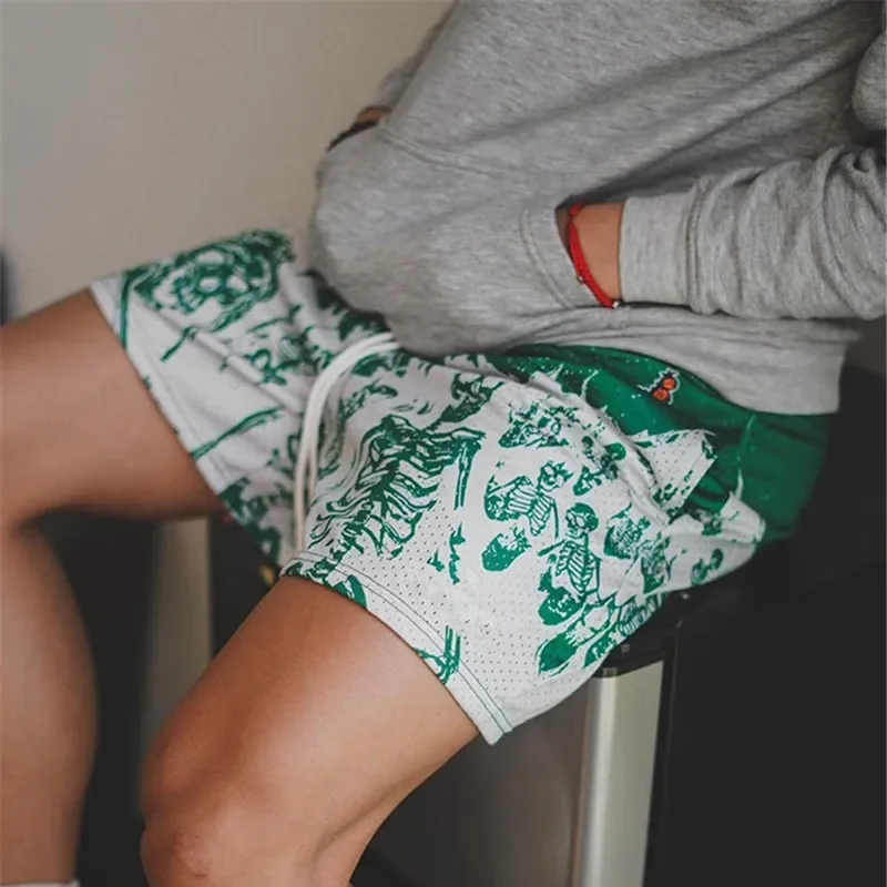 กางเกงขาสั้นลำลองลายกะโหลกกางเกงสตรีทฮิปฮอปโพลีเอสเตอร์แห้งเร็วสั้นสำหรับผู้ชายใหม่ฤดูร้อนสั้นสำหรับผู้ชายแบบเย็บปัก