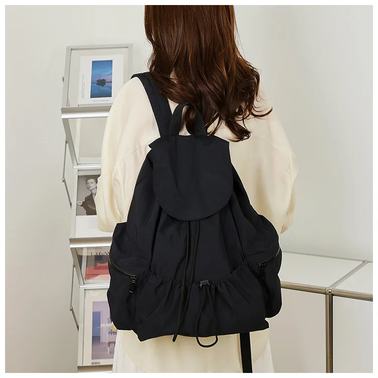 

Ladies Lightweight Nylon Drawstring Backpack Casual Rucksack with Side Pockets and Ruched Bottom for Travel Work and School