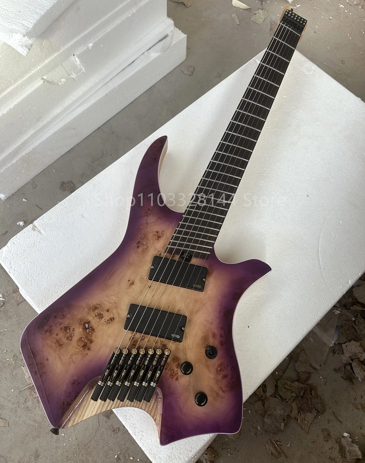 Factory Purple Headless 7 Strings Electric Guitar Ebony Fretboard Ash Body Burl Maple Veneer Maple Neck Customizable