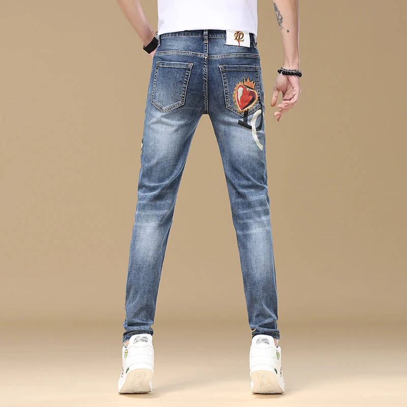 2024 New light luxury jeans men's fashion print slim fit small feet street trend Korean elastic high end denim pants