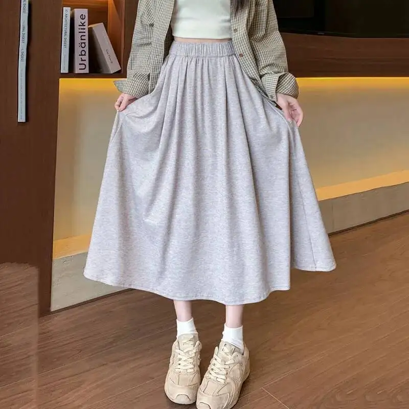 

Винтажная вязаная длинная юбка, женская осенняя новая эластичная женская юбка миди с высокой талией и карманами, однотонные универсальные свободные юбки трапециевидной формы