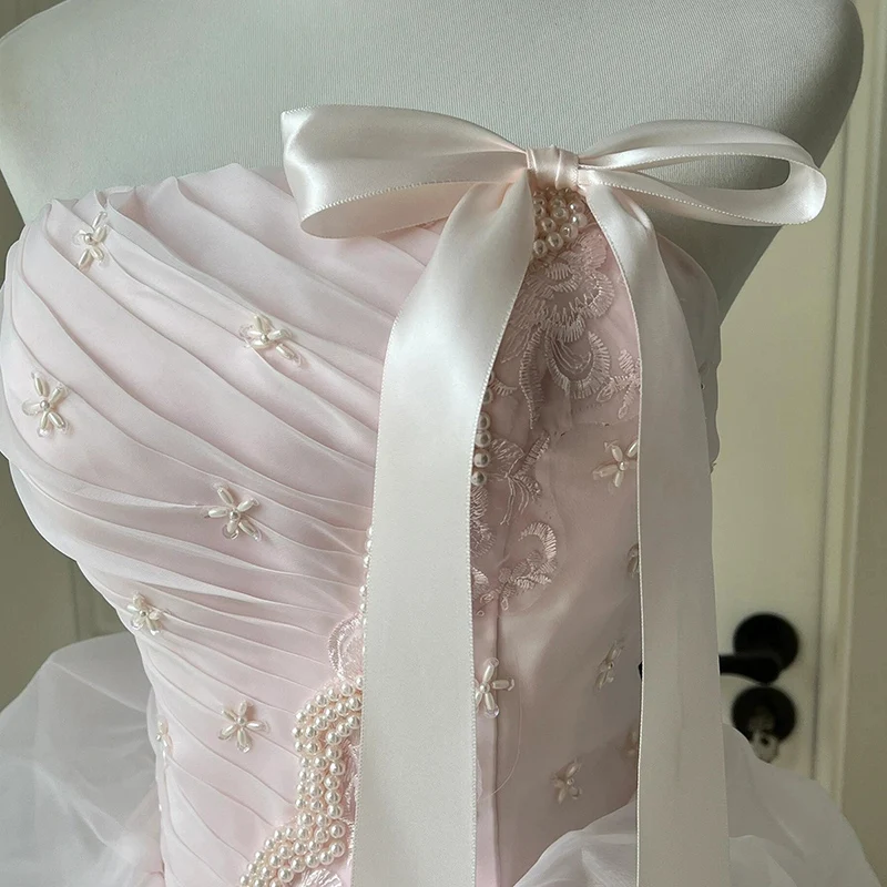 AnXin SH เจ้าหญิงดอกไม้สีชมพูลูกไม้เกาะอกแขนกุดประดับด้วยลูกปัดมุกโบว์รัฟเฟิลบอลชุดผูกเชือกชุดแต่งงานที่กำหนดเอง