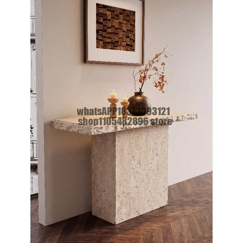 Medieval style natural travertine entrance table against the wall Ultra-narrow entrance is opposite the door entrance table
