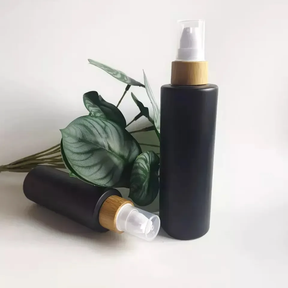 Cylinder Empty Black Frosted Glass Lotion Bottle Manufacturer Black Cosmetic Bottle Opaque Cosmetic Bamboo Pump Bottle forLotion