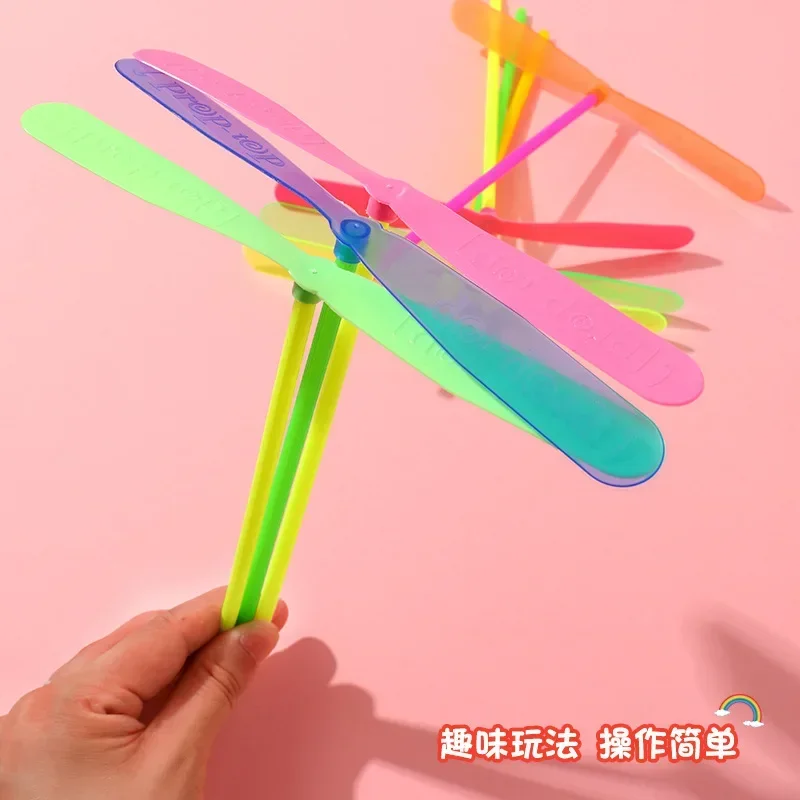 

5pcs Plastic Bamboo Dragonfly Shape Hand Push Flying Propeller Outdoor Sports Game Kids Toy Rotating Flying Arrow Outdoor Games