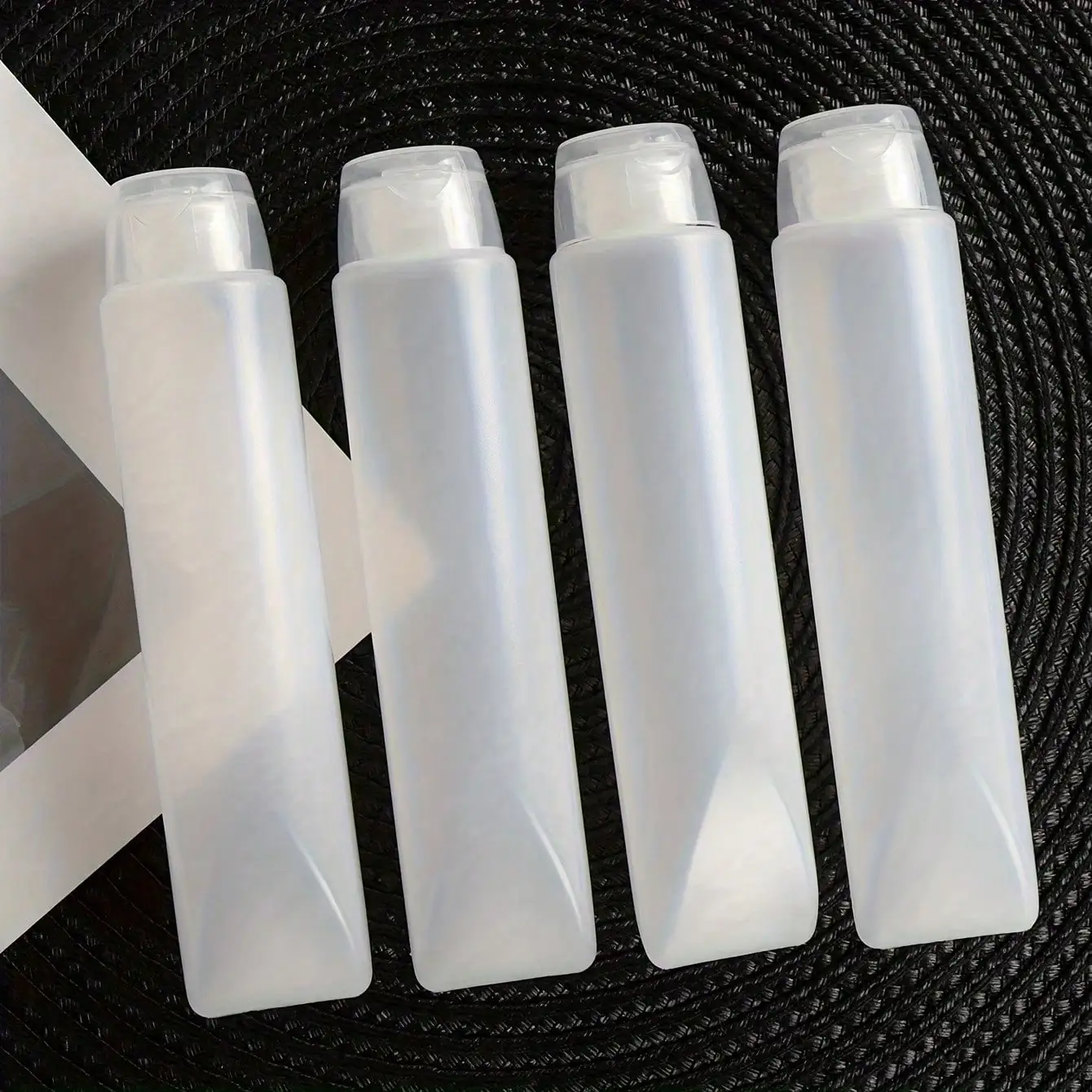 4 Stück auslaufsichere Quetschflaschen mit Klappverschluss, 1,69 Unzen, wiederverwendbare Behälter in Reisegröße für Conditioner – kompakte tragbare Flaschen