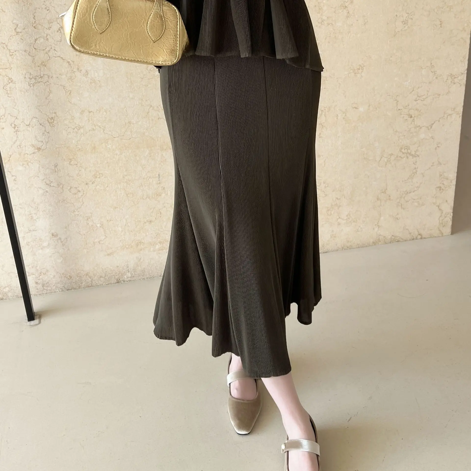 Miyake plisado 2026 otoño y primavera nueva ropa plisada de alta gama viajero cien con paquete falda de medio cuerpo de cola de pez a la cadera