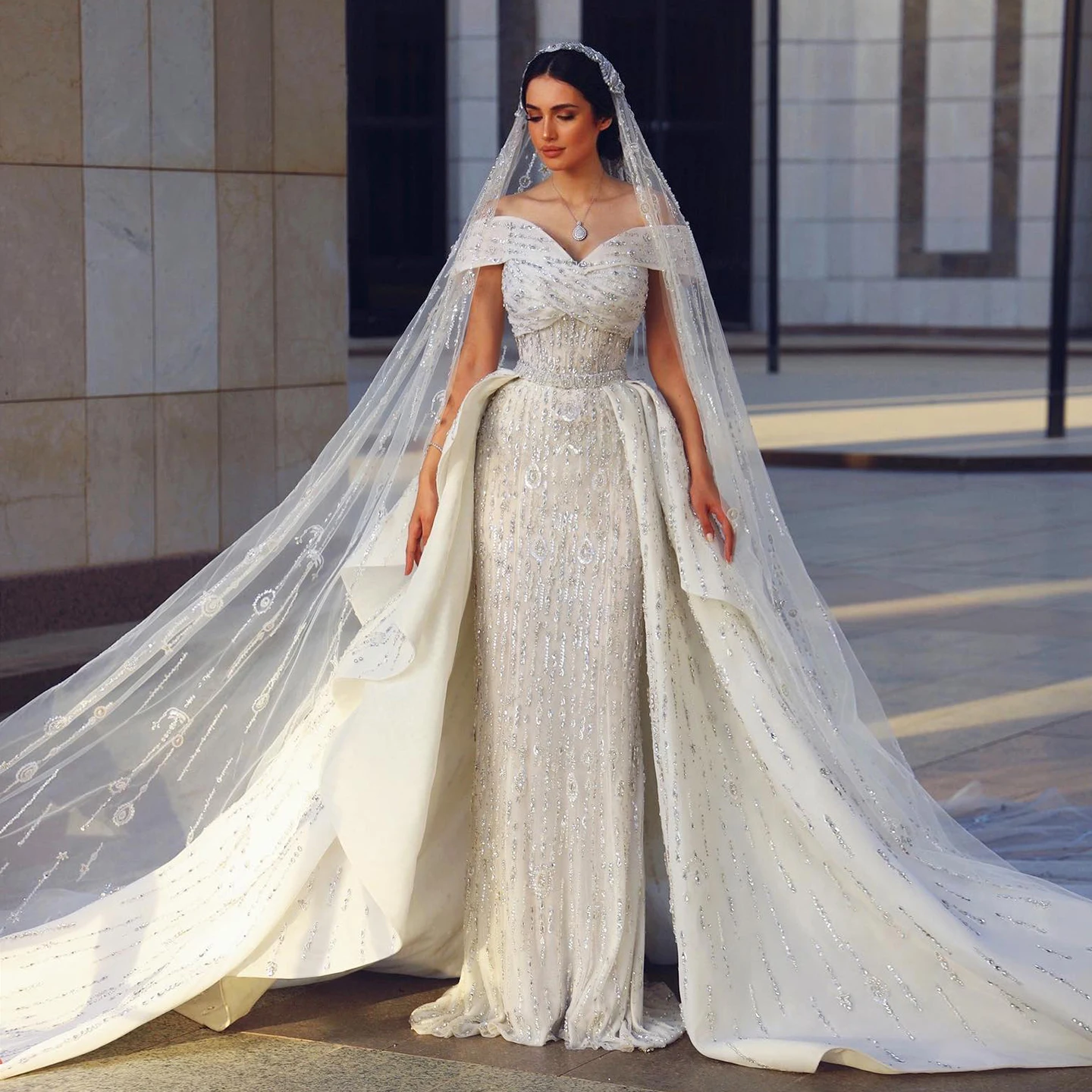 

Sharon Said 2025 Luxury Dubai Beaded Mermaid Tulle Wedding Dress With Overskirt Off Shoulder Arabic Bride Gowns SW031 Customized