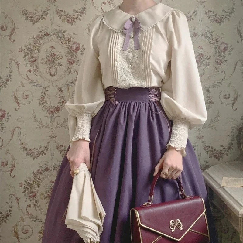 قمصان كلاسيكية أنيقة على طراز لوليتا للسيدات بلوزات مطرزة بالدانتيل بأكمام حلوة فستان بفيونكة لطيف للسيدات 2025 تخفيضات هائلة