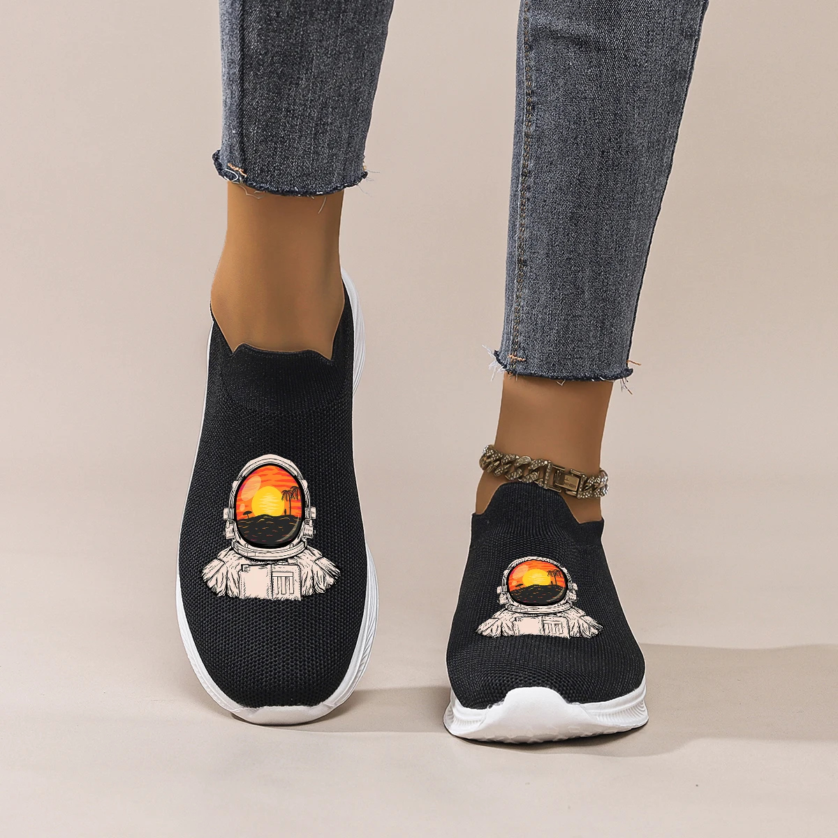 

Women's Black Mesh Slip-On Sneakers with Astronaut Print: Breathable & Lightweight for Daily Commute, Shopping & Casual Wear.