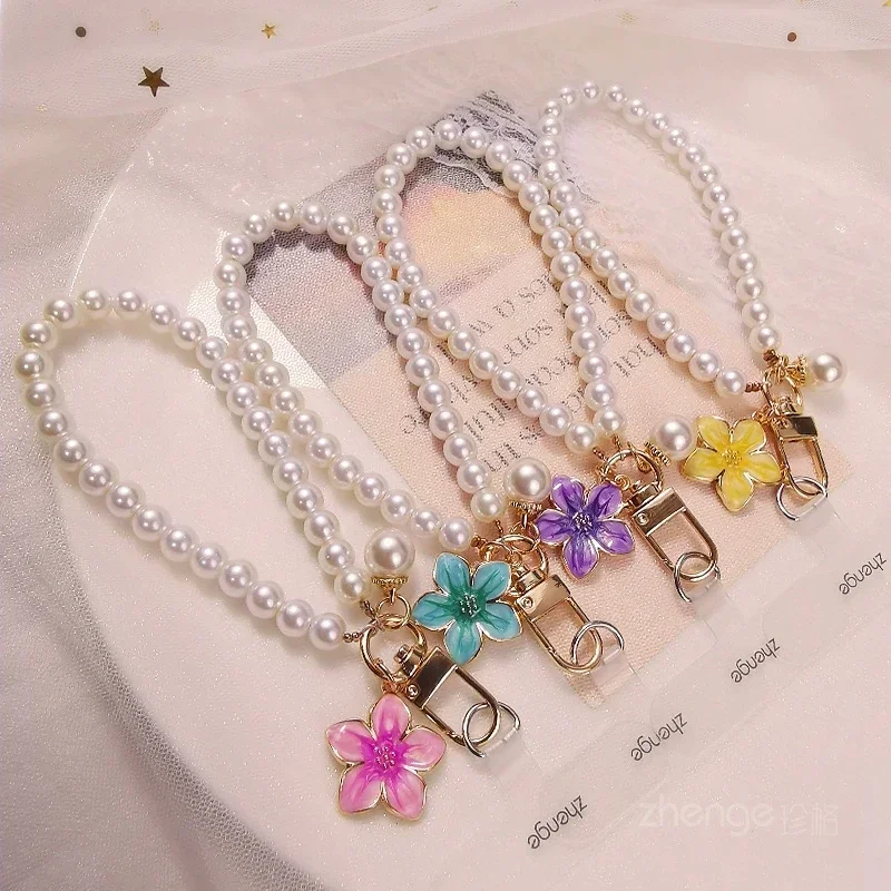 

Hua Nian Hua Pearl Mobile Phone Chain Women's Pearl Fashion Small Fragrance Style Wrist Hanging Decoration Phone Case Universal