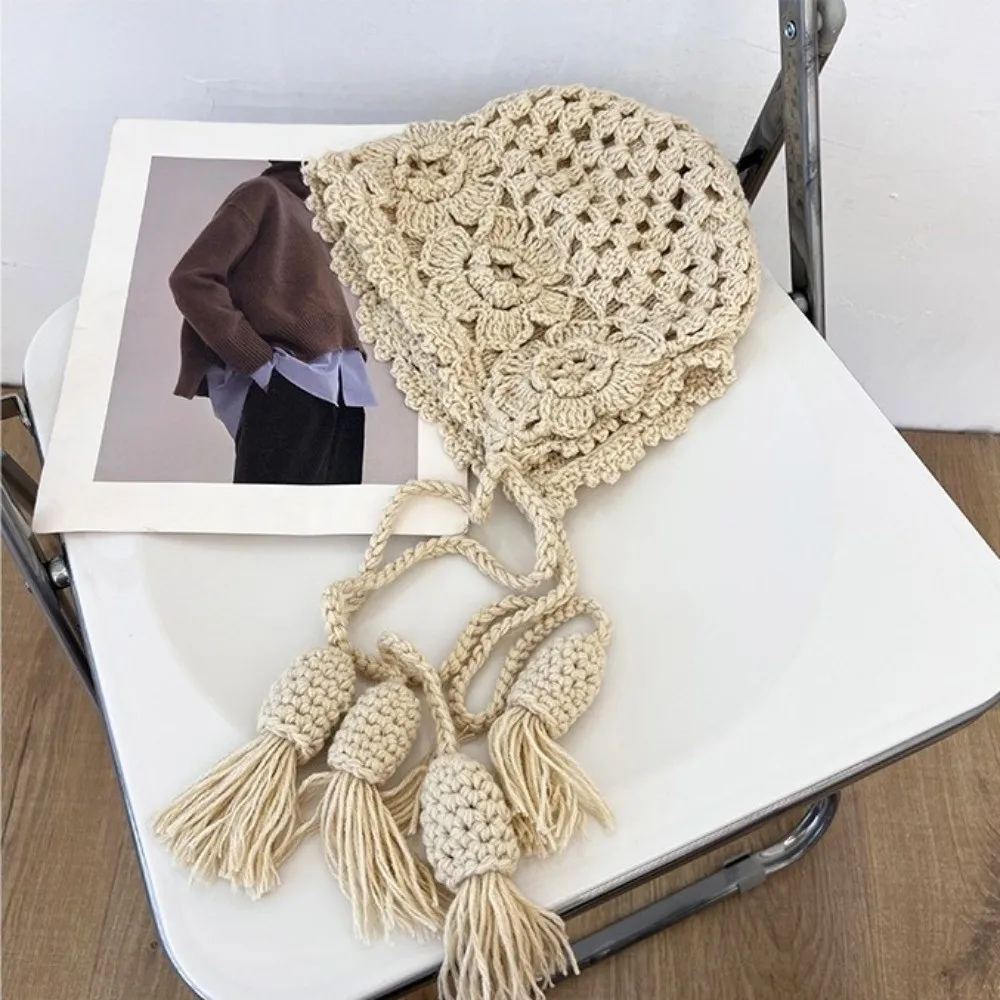 

Casual Hollowed-out Flower Bonnet Hat Long Tassel Windproof Knitted Ear Protection Hat Hand Woven Crochet Earmuffs Cap