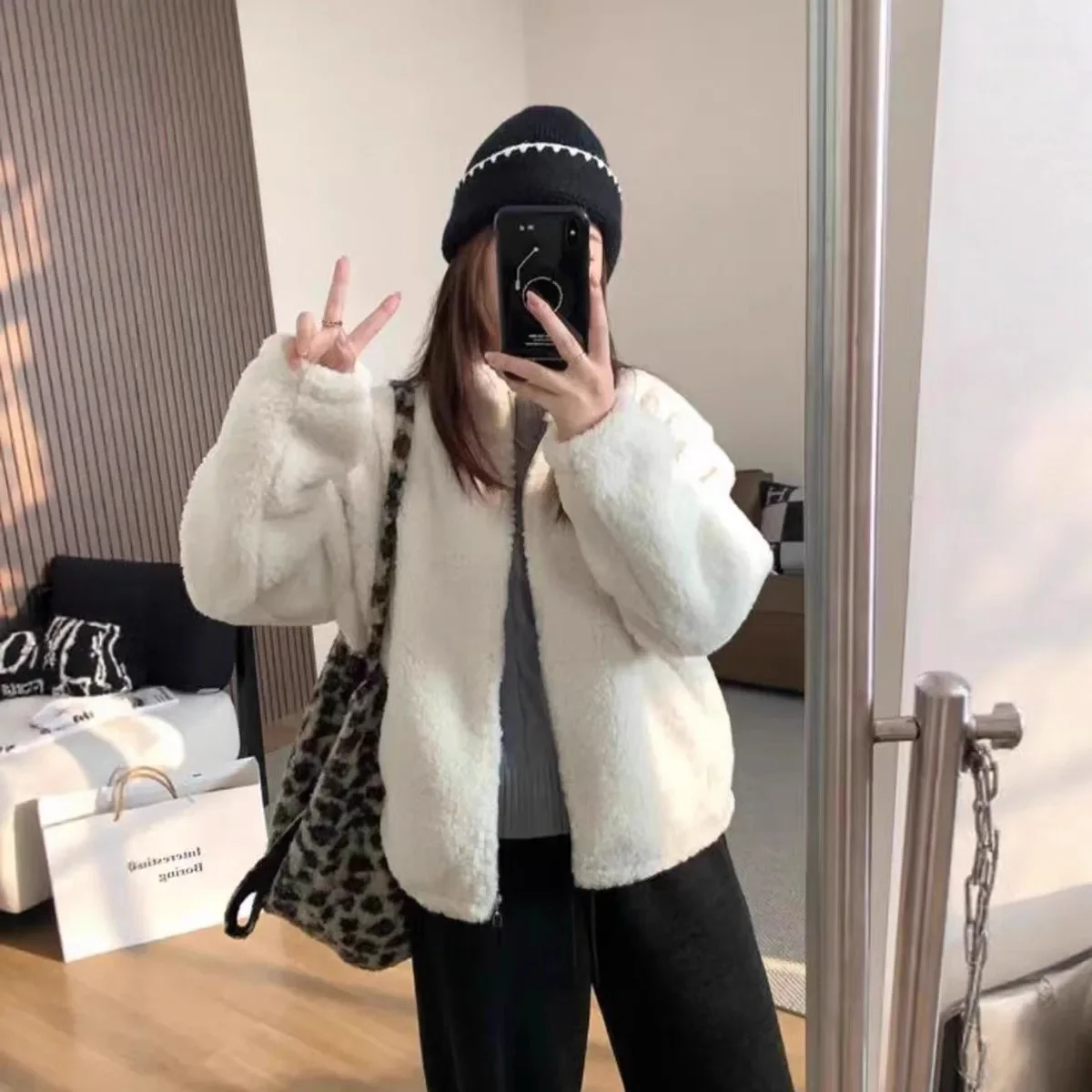 Stand-up collar lamb wool coat women's 2025 winter new loose and versatile casual thickened warm coat