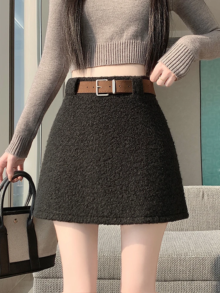 

Женская зимняя шерстяная юбка с высокой талией, новая модель, А-силуэт, универсальная, облегающая, черная, простой дизайн, элегантная.