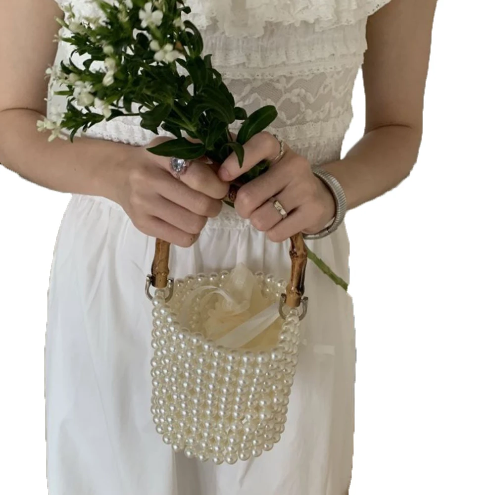 Bolso de perlas con asa de bambú, bolso de lujo con cuentas para fiesta de noche, bolsos de diseñador, bolso de cubo tejido hueco, embrague de boda hecho a mano, nuevo