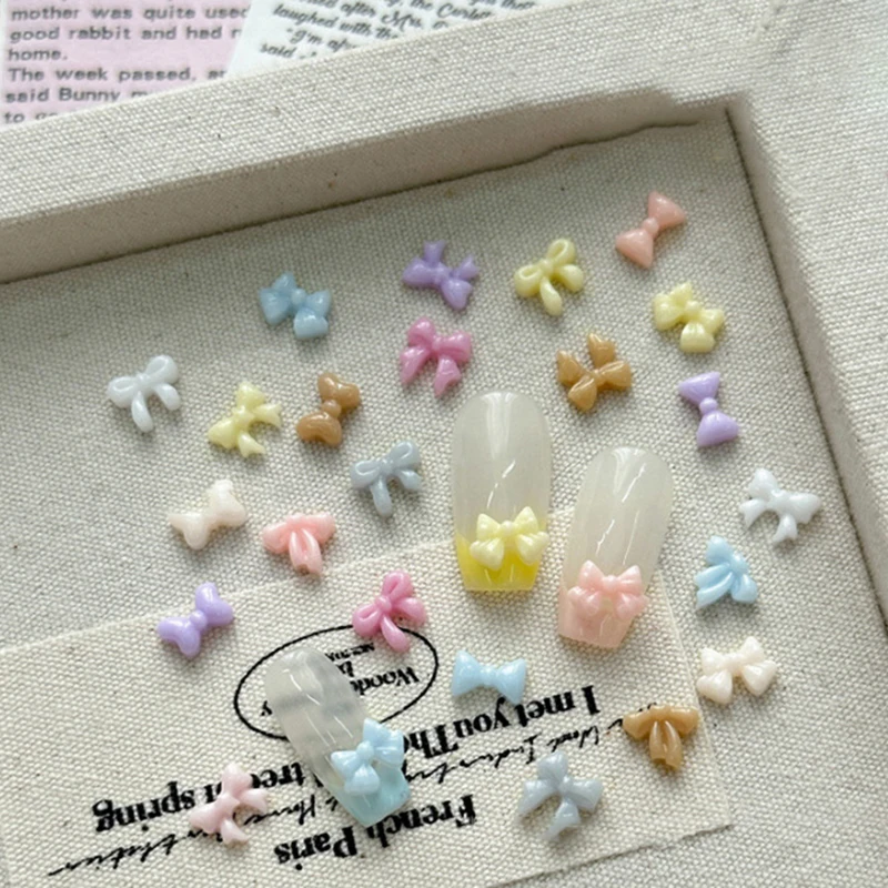 100 ชิ้น Mini Bow ตกแต่งเล็บใหม่ Candy สีเรซิ่นริบบิ้นผสมเครื่องประดับเจาะเล็บอุปกรณ์เสริม