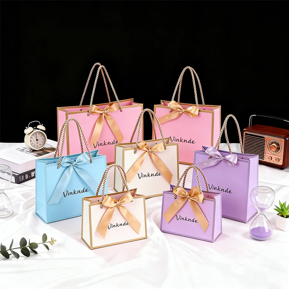 

Luxury Black Pink Paper Gift Bag with Bow Ribbon Handles Custom Logo for Jewelry Necklace Bracelet Earring Travel Packaging Box