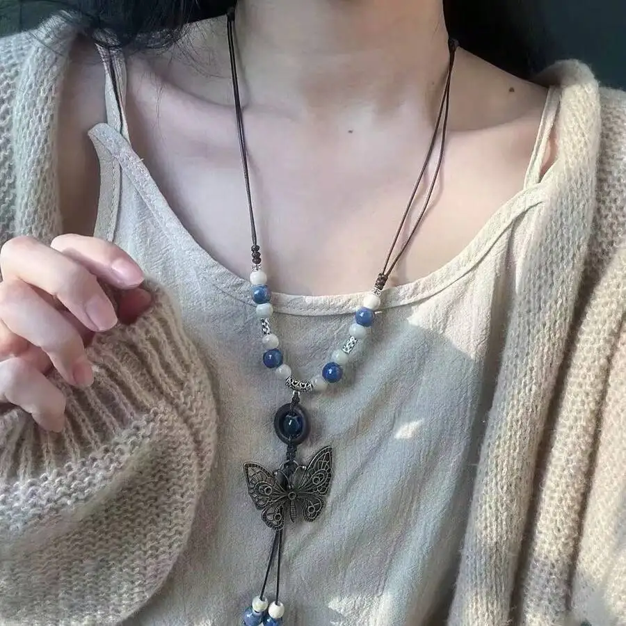 

Ожерелье с подвеской в ​​стиле бохо с синими и белыми бусинами и регулируемым шнурком