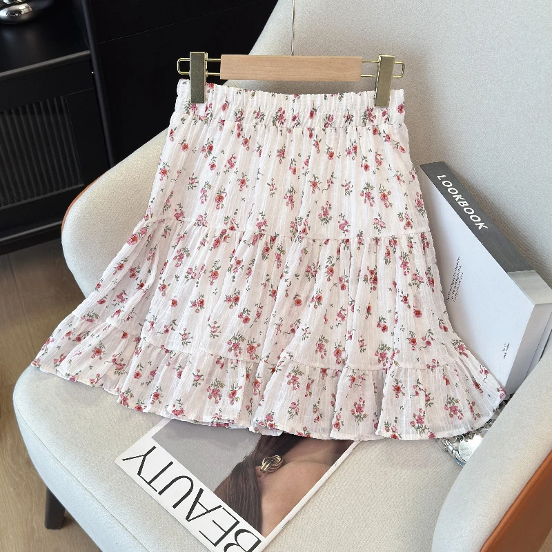 伸縮性のある韓国風レディーススカート、夏のプリントチュチュフック、花柄ルーズミディスカート、エレガントな女性用カジュアルオールマッチスカート、新作