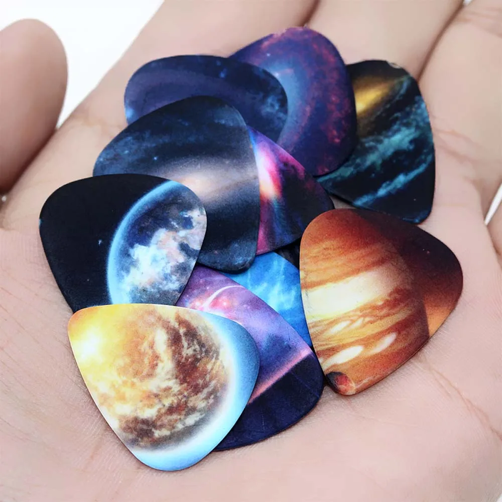 10pcs/Lot 0.71mm thickness Vastness of the universe Star guitar picks pattern guitar strap guitar parts Guitar Accessories