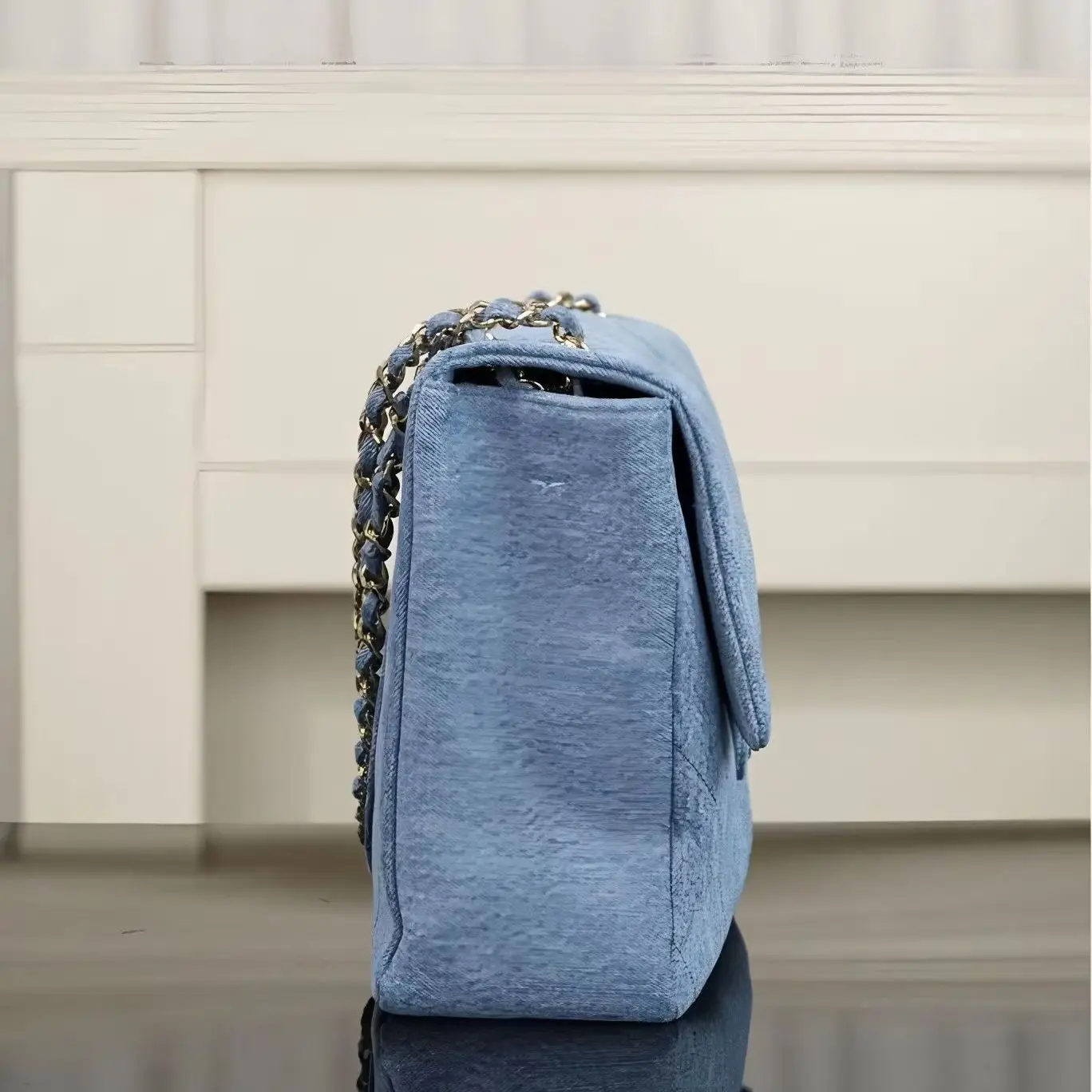 

Casual light-wash denim shoulder bag, featuring diamond quilting, soft silhouette and polished gold-tone chain.