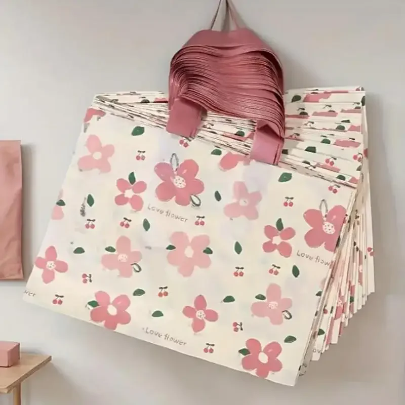

50PCS Handheld Plastic Clothing Bags Popular Online Fashion Store Packaging Bags Beauty Store Shopping Bags Gift Collection